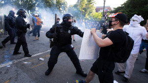 Police officers clash with protestors near the White House on June 1, 2020 as demonstrations against George Floyd's death continue. - Police fired tear gas outside the White House late Sunday as anti-racism protestors again took to the streets to voice fury at police brutality, and major US cities were put under curfew to suppress rioting.With the Trump administration branding instigators of six nights of rioting as domestic terrorists, there were more confrontations between protestors and police and fresh outbreaks of looting. Local US leaders appealed to citizens to give constructive outlet to their rage over the death of an unarmed black man in Minneapolis, while night-time curfews were imposed in cities including Washington, Los Angeles and Houston. (Photo by Jose Luis Magana / AFP) / ALTERNATE CROP (Photo by JOSE LUIS MAGANA/AFP via Getty Images)