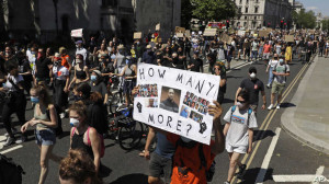 People march towards Trafalgar Square in central London on Sunday, May 31, 2020 to protest against the recent killing of George Floyd by police officers in Minneapolis that has led to protests across the US. (AP Photo/Matt Dunham)